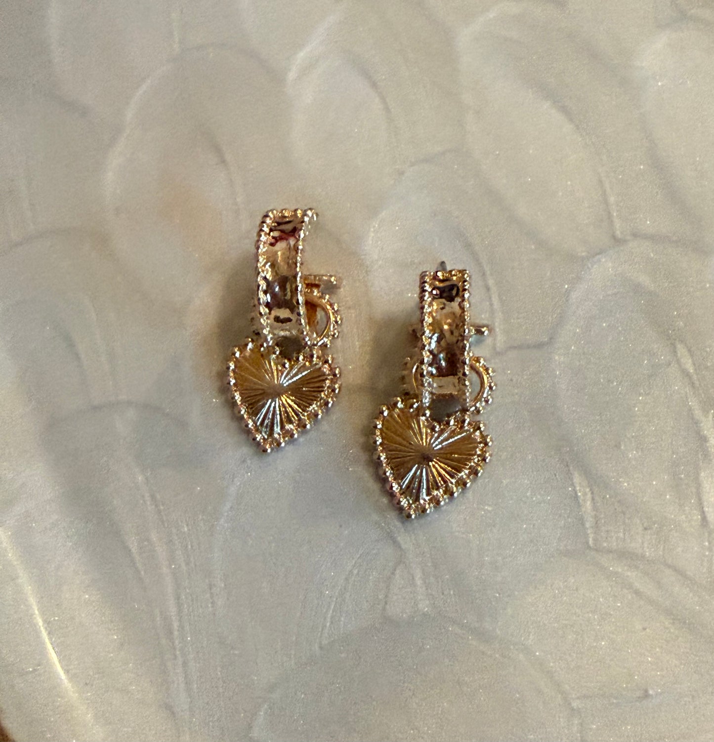 Gold heart-shaped earrings 